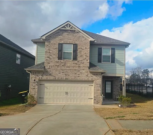 a front view of a house with yard