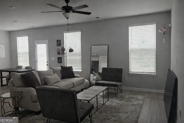 a living room with furniture and a window