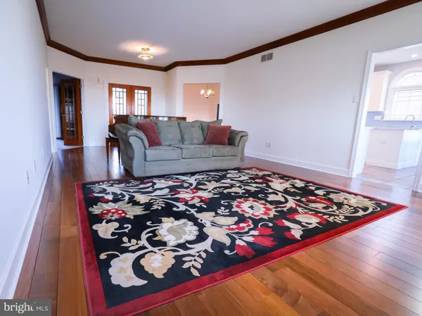 a living room with furniture and a rug