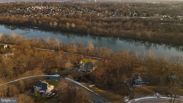 an aerial view of a house with a lake view