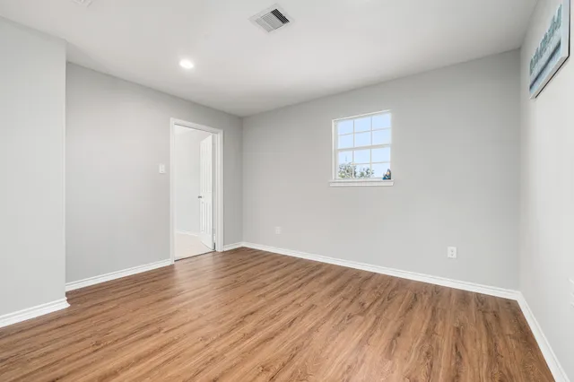 a view of a livingroom with wooden floor