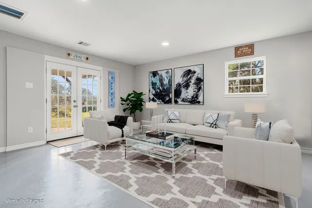 a living room with furniture and a large window