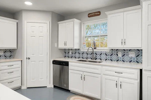 a view of a sink and cabinets