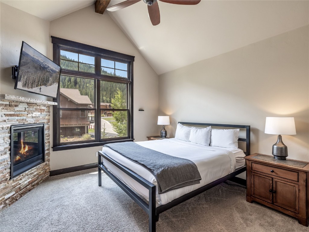 68 Independence Lane Keystone, CO 80435 - Photo 15 of 43 a bedroom with a large bed and a tv