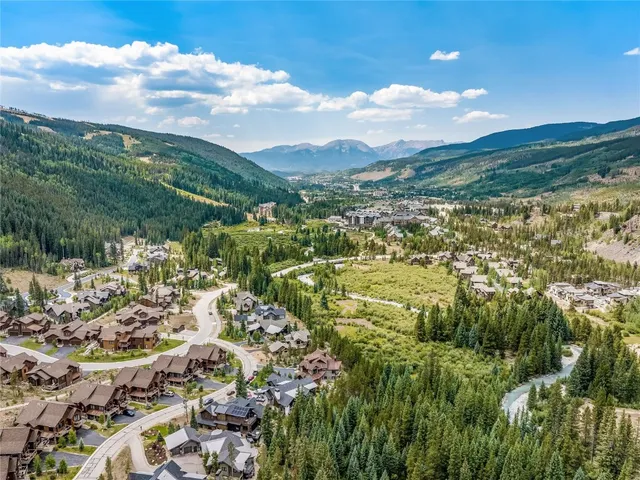 a bedroom with a large bed and a tv