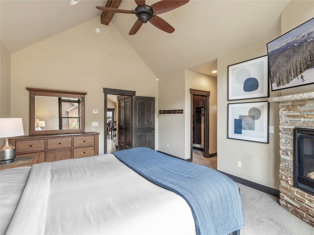 68 Independence Lane Keystone, CO 80435 - Photo 20 of 43 a bedroom with a large bed and a chandelier