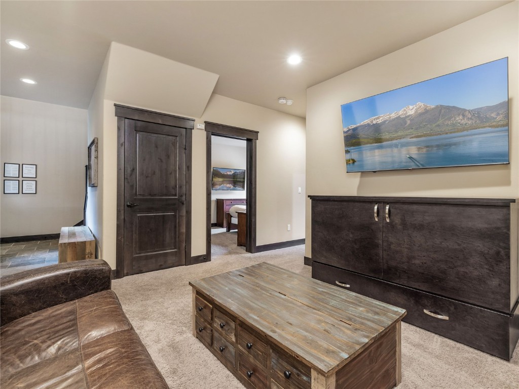 68 Independence Lane Keystone, CO 80435 - Photo 24 of 43 a living room with a table and potted plant