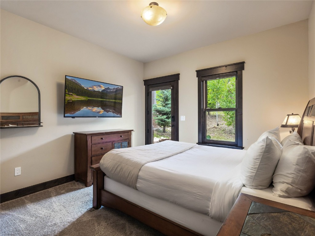 68 Independence Lane Keystone, CO 80435 - Photo 25 of 43 a bedroom with a bed and a flat screen tv
