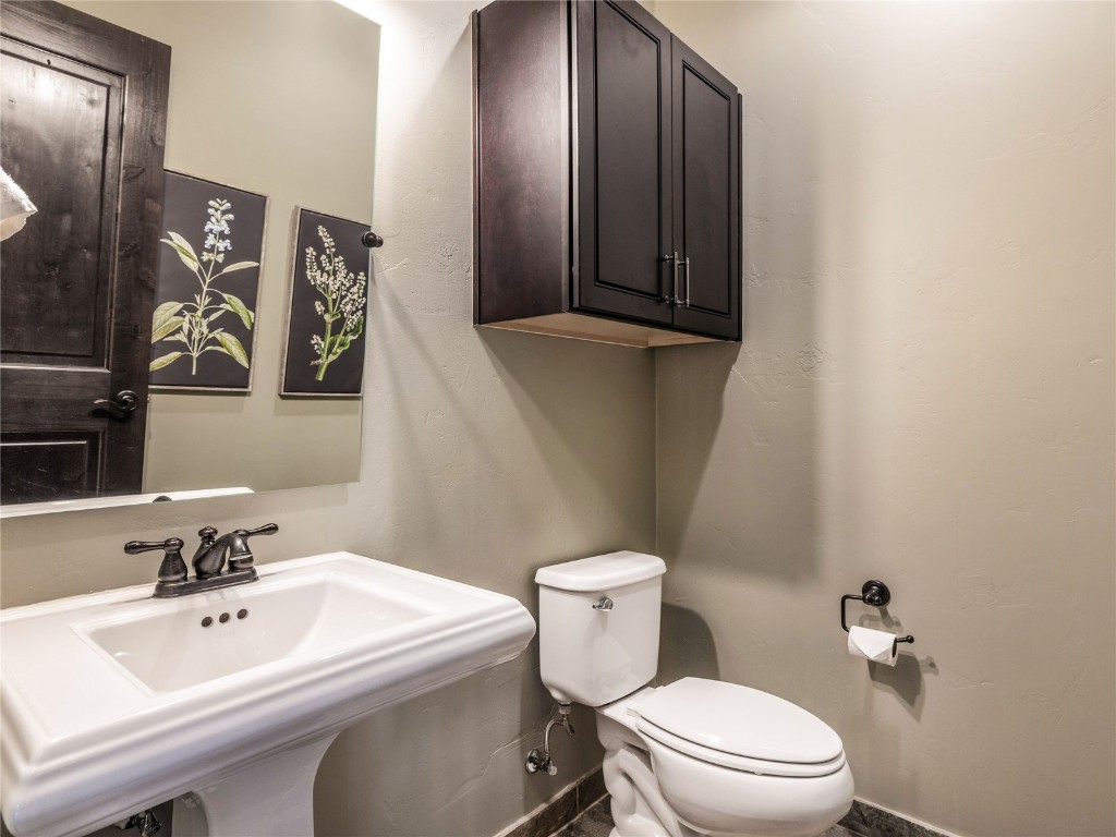 68 Independence Lane Keystone, CO 80435 - Photo 29 of 43 a bathroom with a sink and mirror with toilet