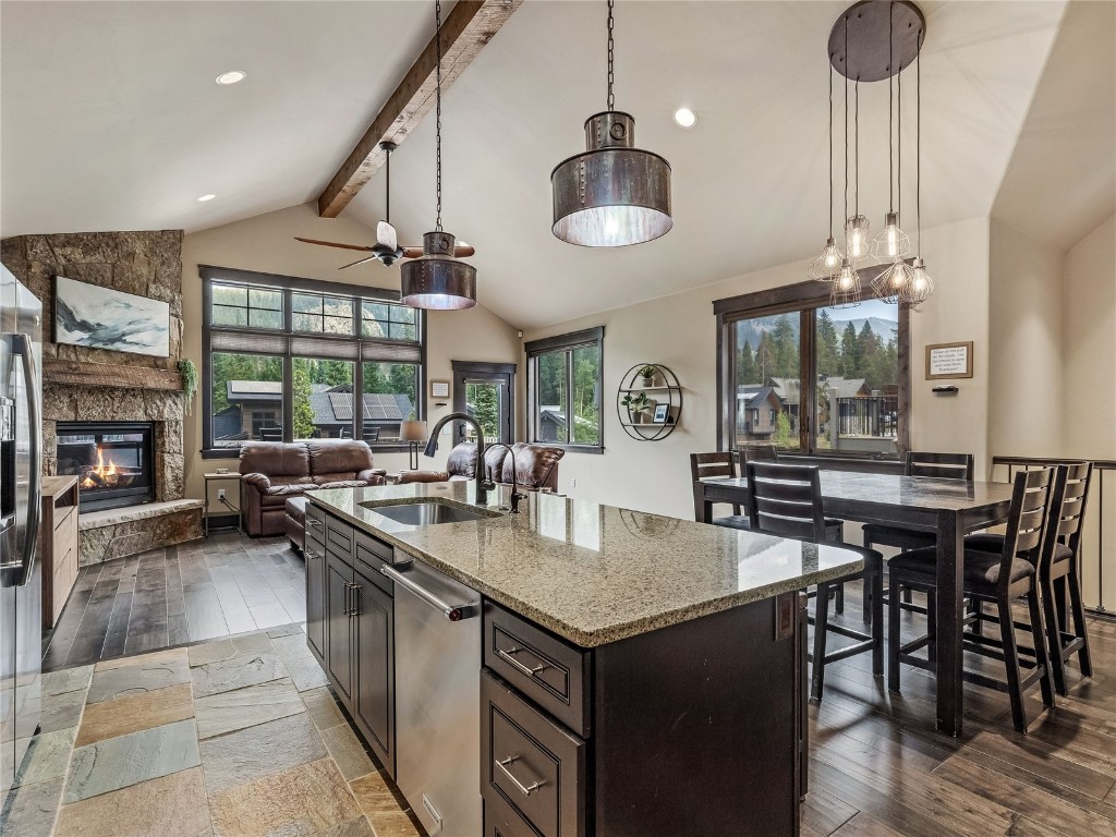 68 Independence Lane Keystone, CO 80435 - Photo 9 of 43 a kitchen with a stove a kitchen island a dining table and chairs