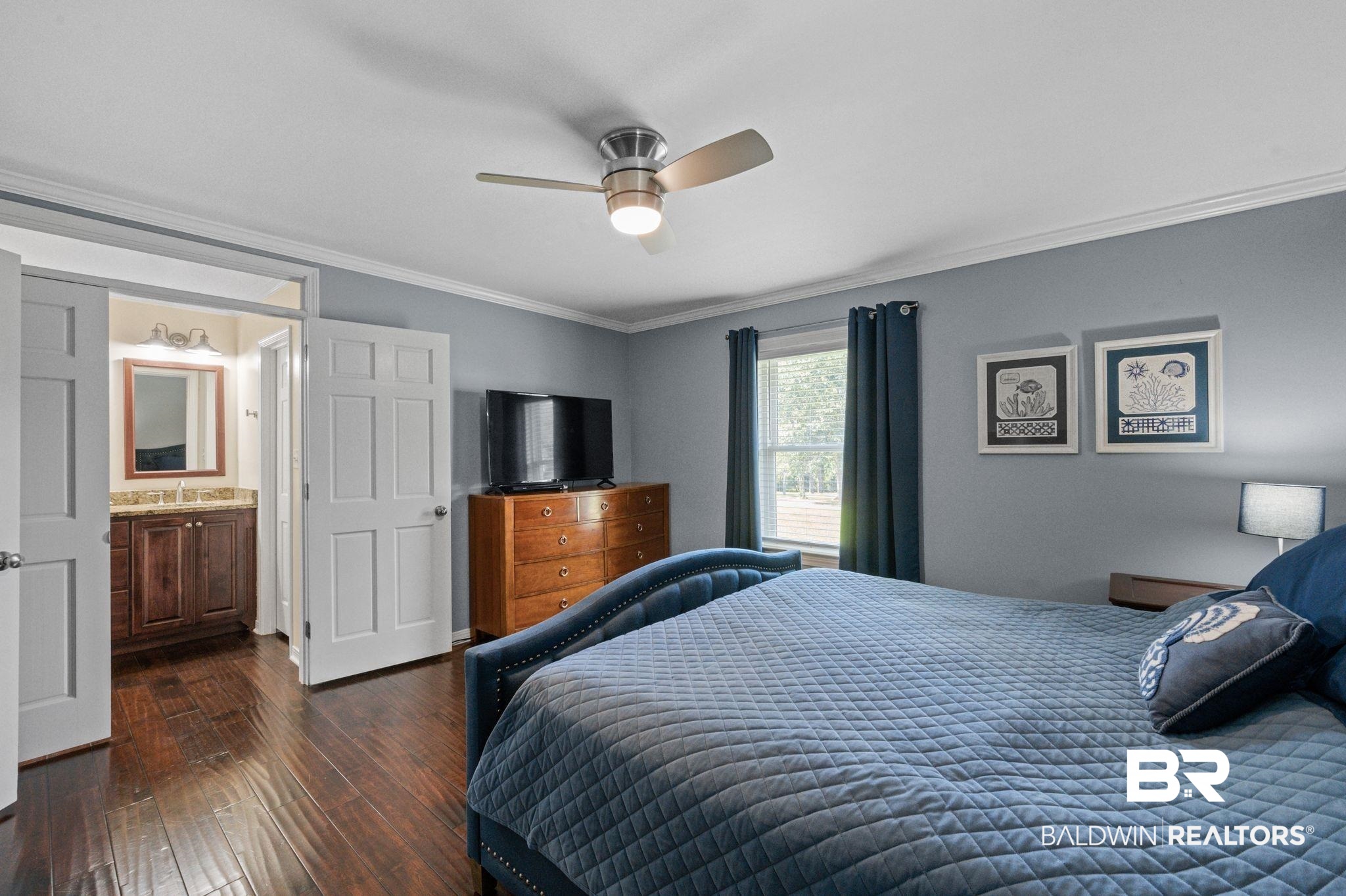 20037 County Road 33 Fairhope, AL 36532 - Photo 21 of 79 Bedroom with sink, ensuite bath, ceiling fan, crown molding, and dark hardwood / wood-style floors