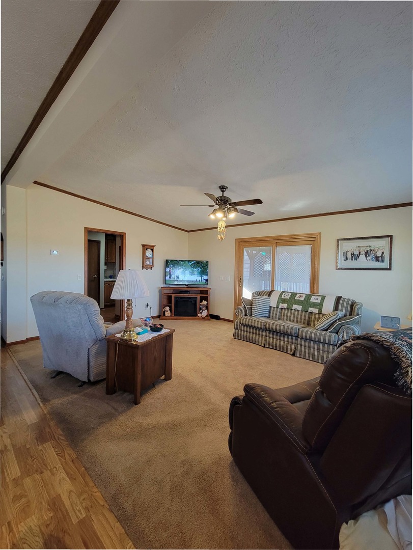 5016 West Colonial Drive, Unit 317 Monee, IL 60449 - Photo 15 of 32 a living room with furniture a fireplace and a flat screen tv