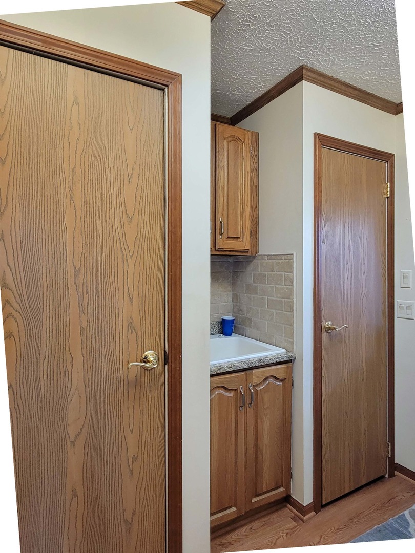 5016 West Colonial Drive, Unit 317 Monee, IL 60449 - Photo 16 of 32 a view of a utility room with a sink