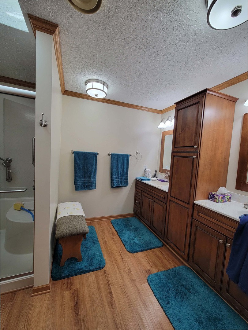 5016 West Colonial Drive, Unit 317 Monee, IL 60449 - Photo 8 of 32 a bedroom with furniture and a mirror