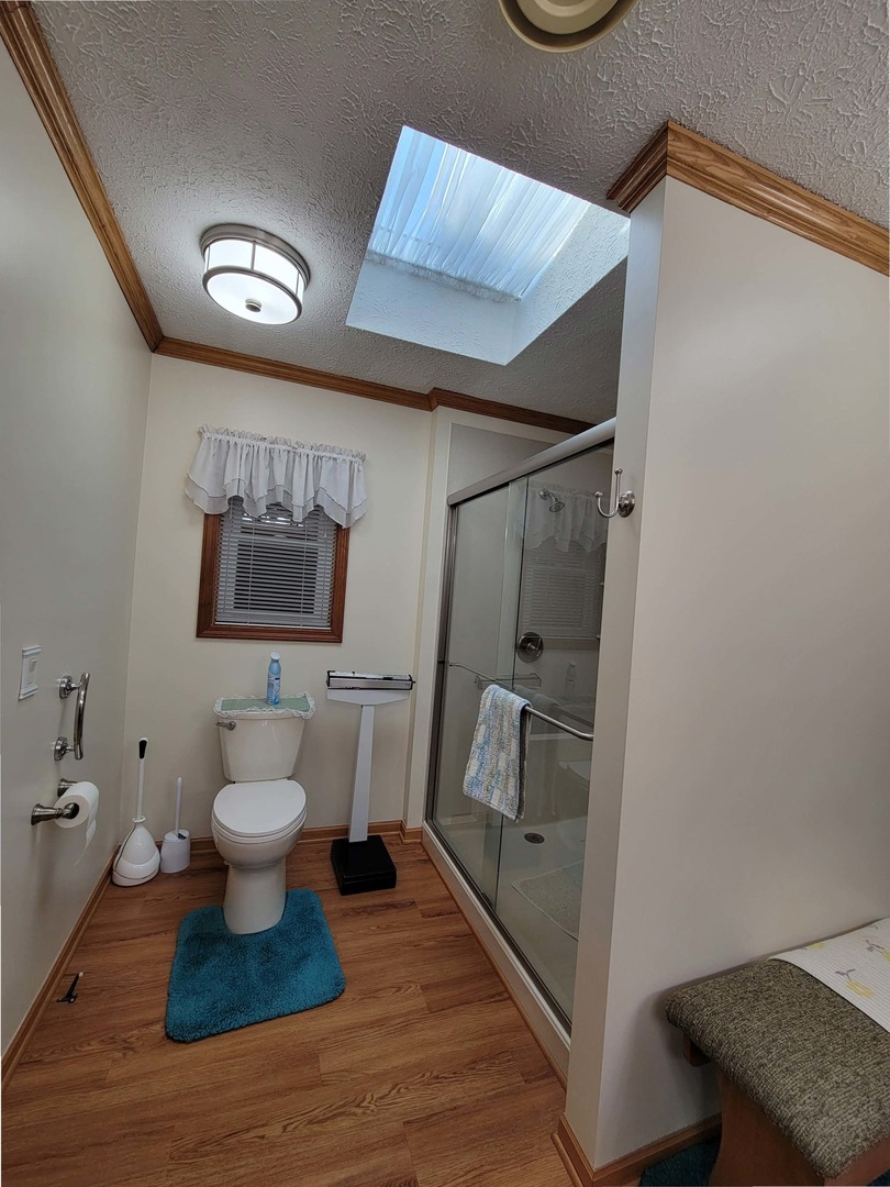 5016 West Colonial Drive, Unit 317 Monee, IL 60449 - Photo 9 of 32 a bathroom with a toilet sink and mirror