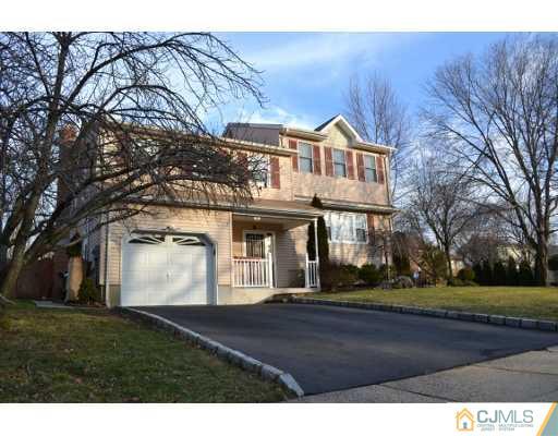 8 Roxy Avenue Edison, NJ 08820 - Photo 2 of 22 a front view of a house with a yard