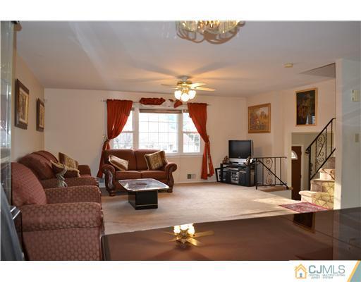 8 Roxy Avenue Edison, NJ 08820 - Photo 12 of 22 a living room with furniture