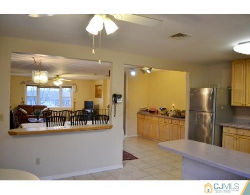 8 Roxy Avenue Edison, NJ 08820 - Photo 13 of 22 a kitchen with a refrigerator and a sink