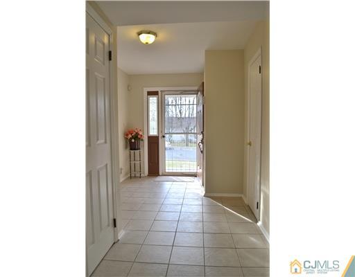 8 Roxy Avenue Edison, NJ 08820 - Photo 17 of 22 a view of a hallway and a dining room with a bathroom