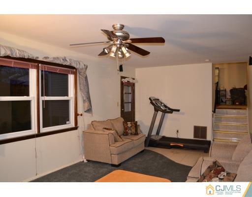 8 Roxy Avenue Edison, NJ 08820 - Photo 19 of 22 a living room with furniture
