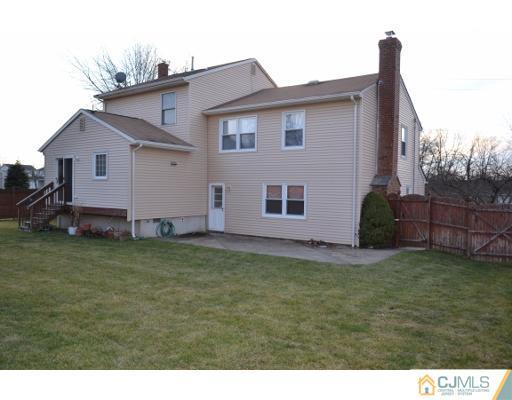 8 Roxy Avenue Edison, NJ 08820 - Photo 3 of 22 a view of a backyard with potted plants