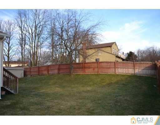 8 Roxy Avenue Edison, NJ 08820 - Photo 5 of 22 a view of outdoor space with deck and yard