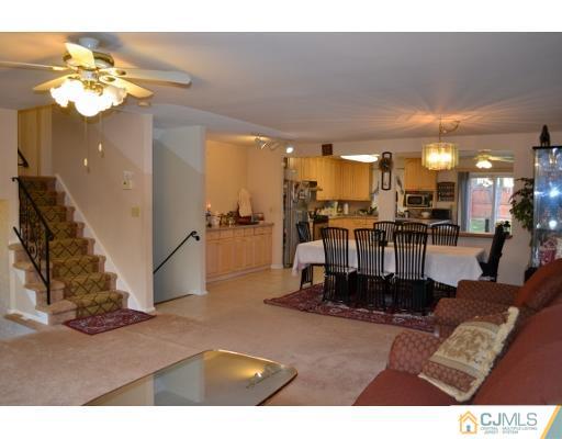 8 Roxy Avenue Edison, NJ 08820 - Photo 7 of 22 a view of a living room and kitchen