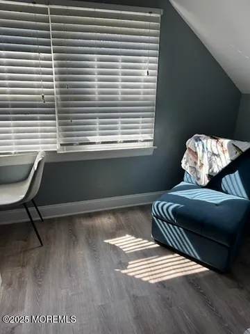 a room with a window and wooden floor