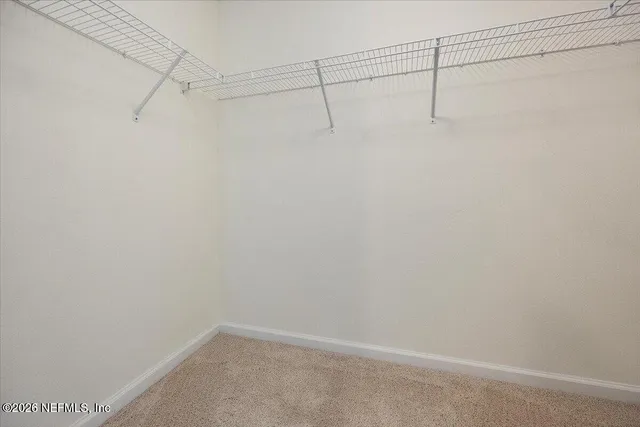a view of a room with racks on the wall