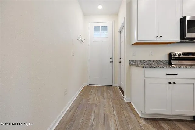 a view of cabinets with wooden floor