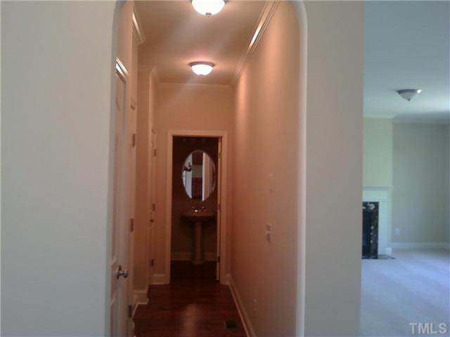 5701 Spring Glen Lane Raleigh, NC 27616 - Photo 7 of 25 a way to rooms with wooden floor
