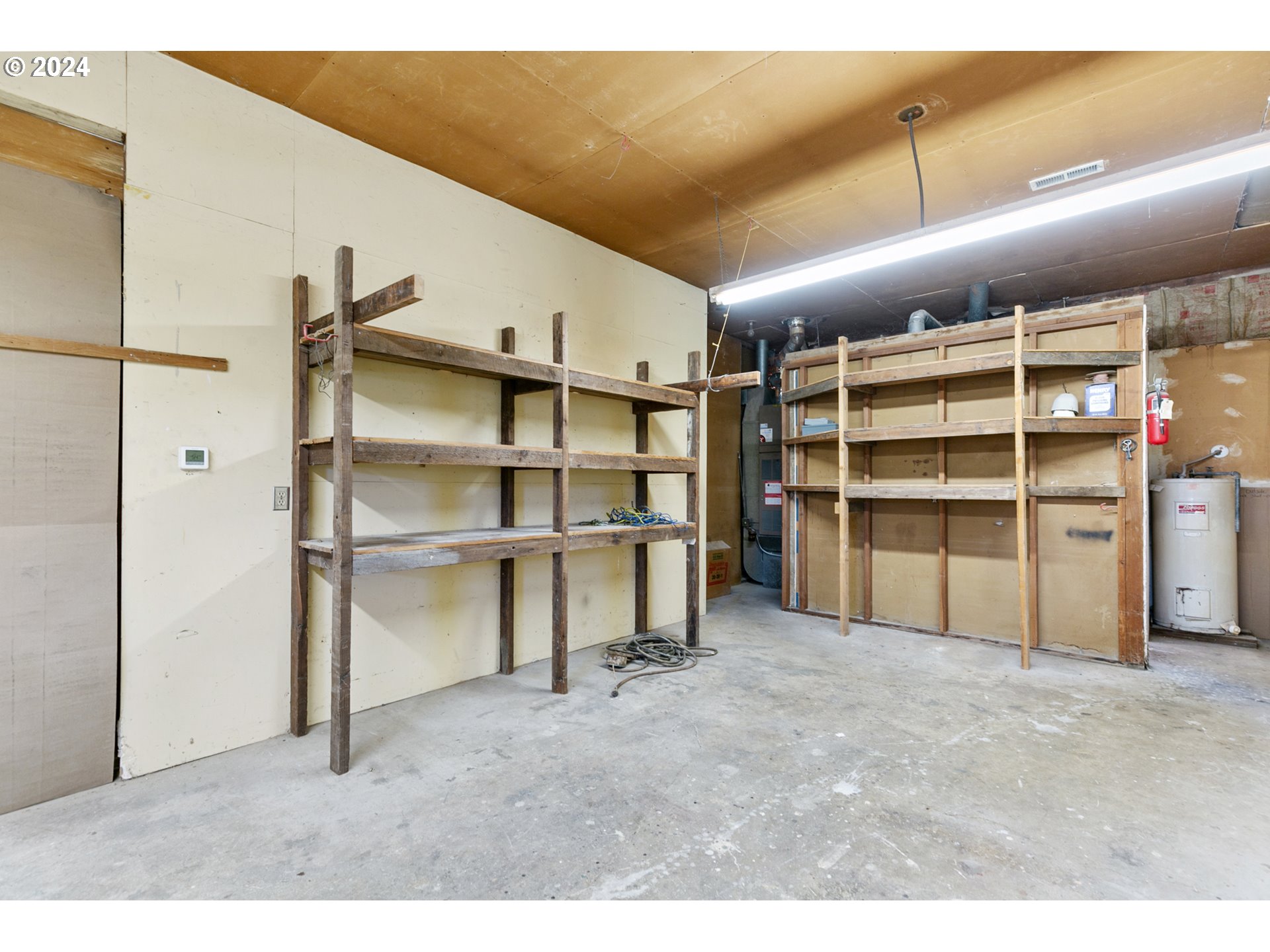 22778 Bents Road Northeast Aurora, OR 97002 - Photo 40 of 48 a view of empty room with wooden shelves