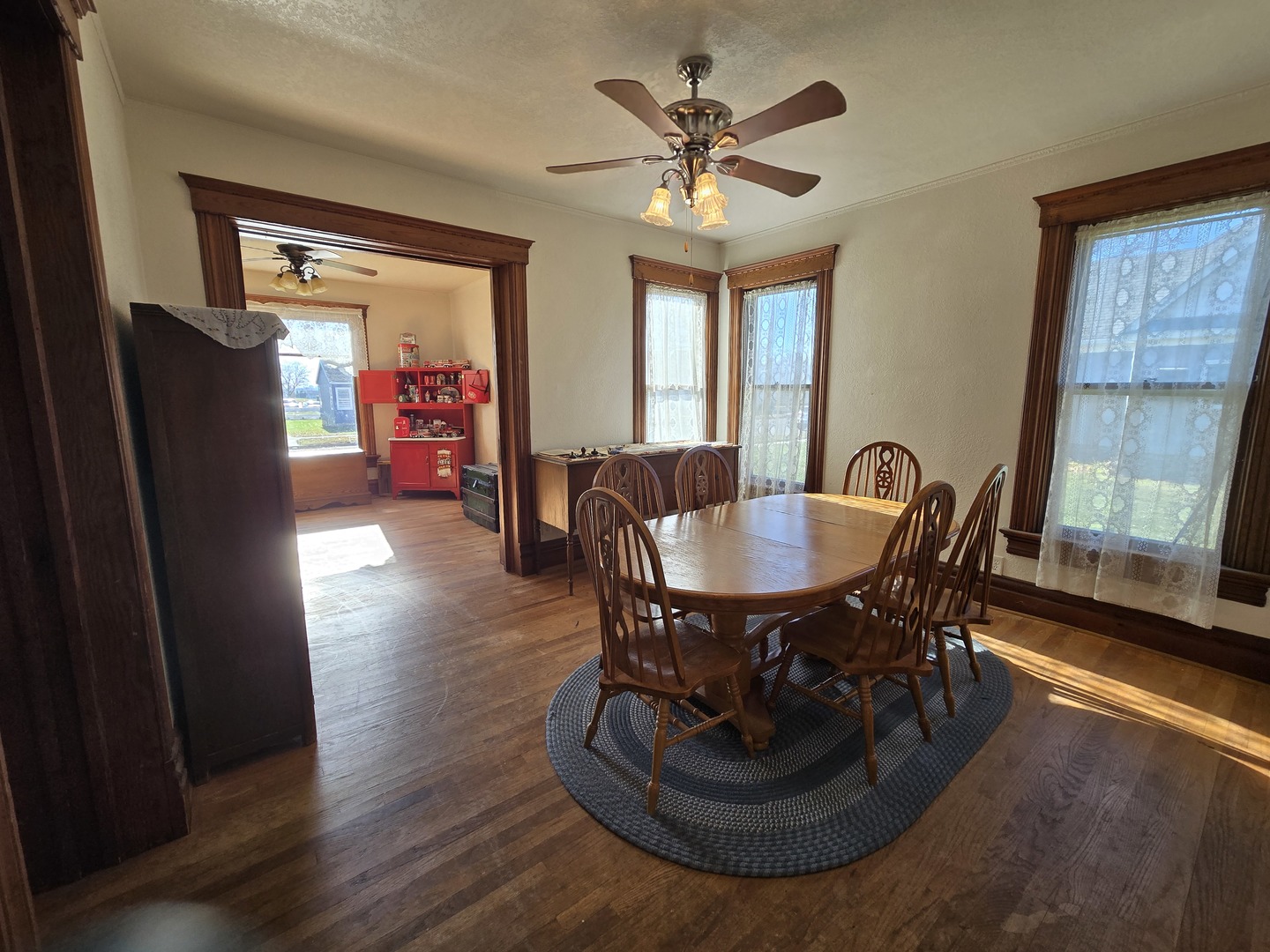 516 East Buffalo Street Polo, IL 61064 - Photo 11 of 28 a dining room with furniture a chandelier and wooden floor