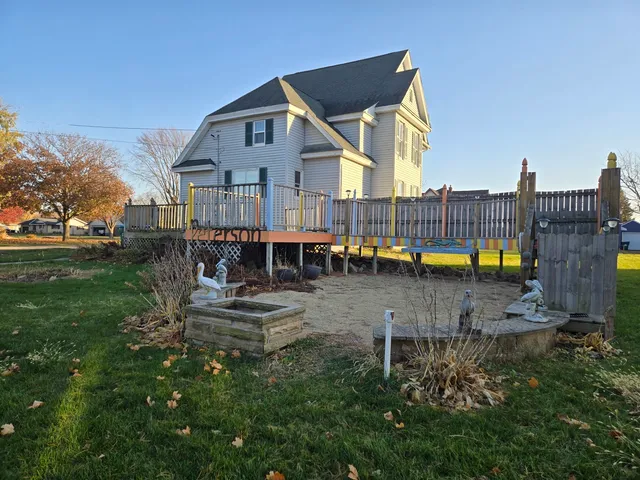 a view of a house with swimming pool and sitting area