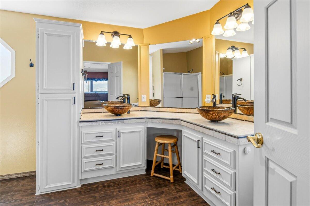 11182 Southwest Dynamite Lane Culver, OR 97734 - Photo 41 of 70 a spacious bathroom with a double vanity sink and a mirror