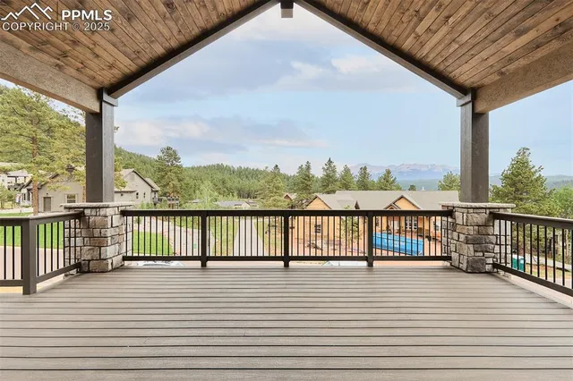 a view of a balcony with wooden floor