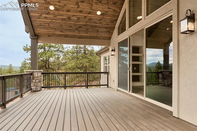 a view of balcony with wooden floor
