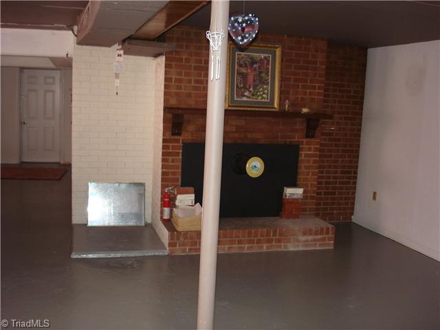2288 Old Liberty Road Randleman, NC 27317 - Photo 10 of 16 Other. Basement with fireplace