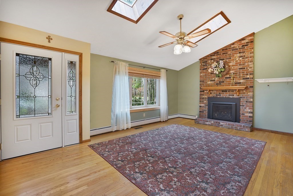 17 Pequot Road Southampton, MA 01073 - Photo 12 of 41 a view of an empty room with window and fireplace