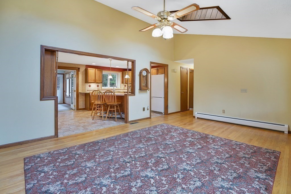 17 Pequot Road Southampton, MA 01073 - Photo 14 of 41 a view of a livingroom with wooden floor and a ceiling fan