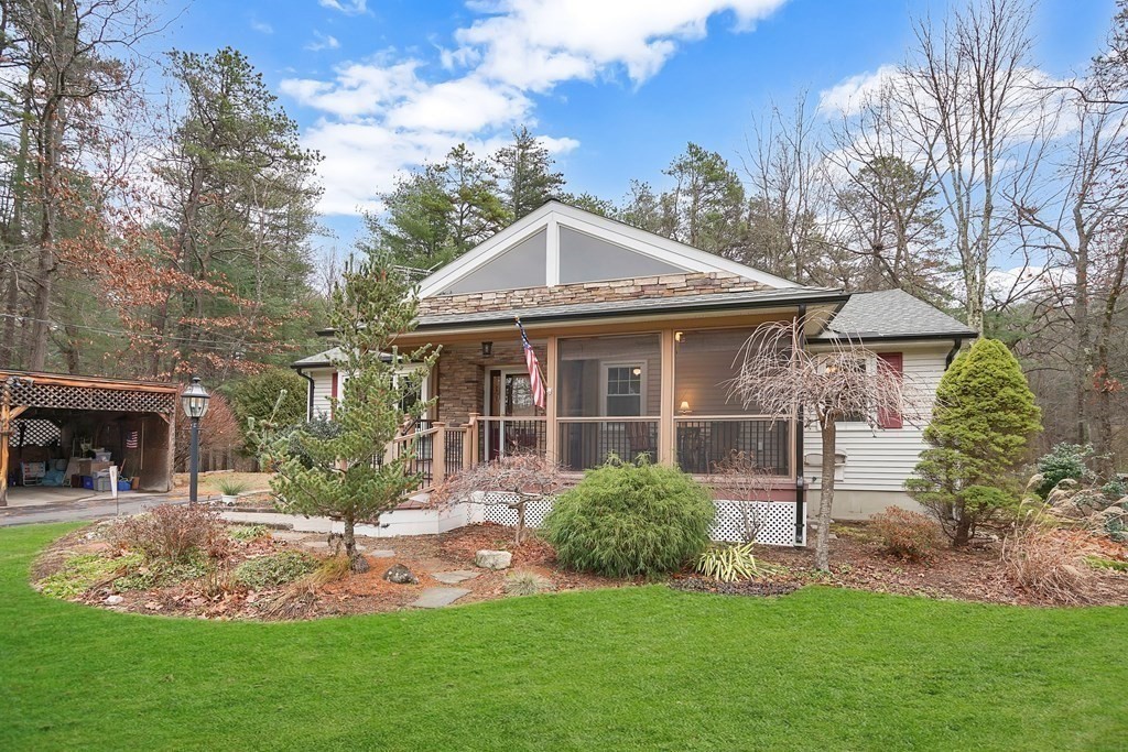 17 Pequot Road Southampton, MA 01073 - Photo 2 of 41 a front view of a house with a yard table and chairs