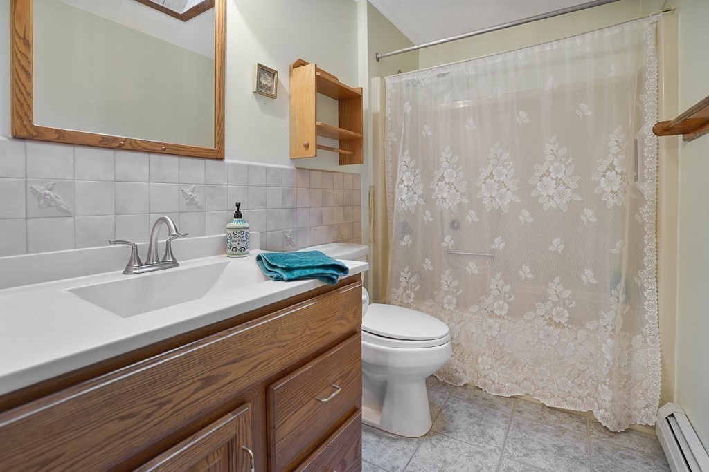 17 Pequot Road Southampton, MA 01073 - Photo 23 of 41 a bathroom with a sink a toilet and shower