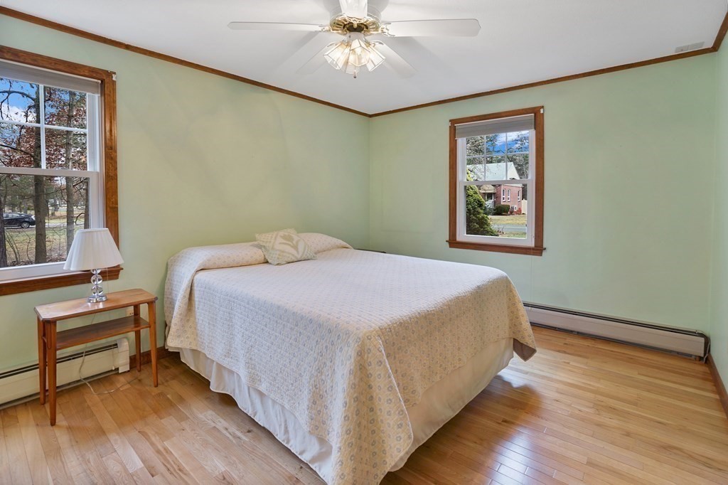 17 Pequot Road Southampton, MA 01073 - Photo 25 of 41 a bedroom with a bed and a chandelier