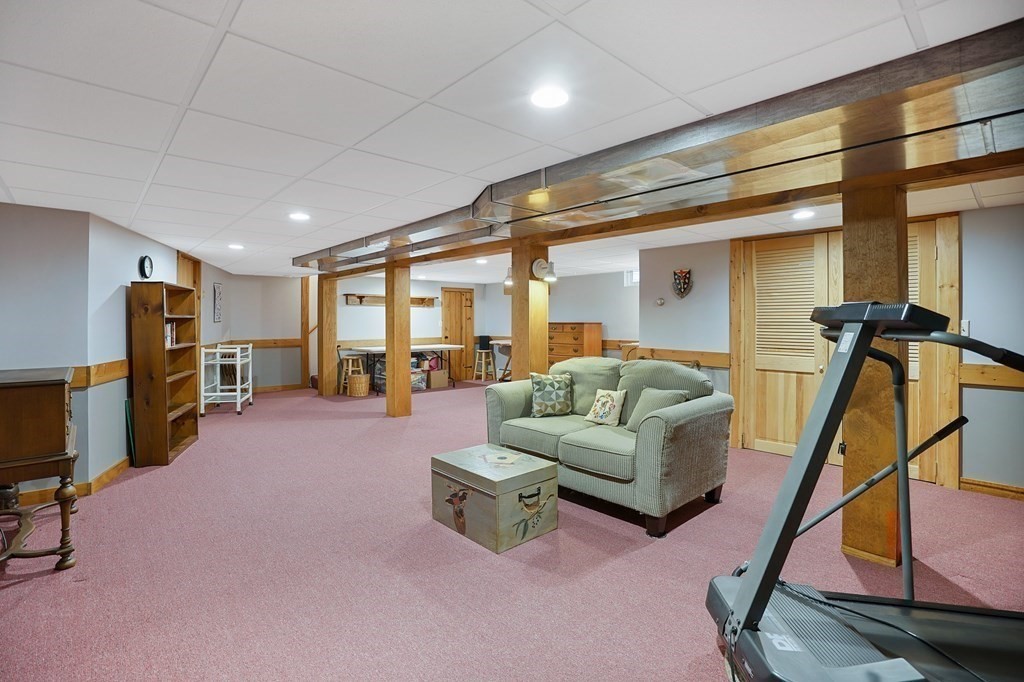 17 Pequot Road Southampton, MA 01073 - Photo 32 of 41 a living room with furniture and a flat screen tv