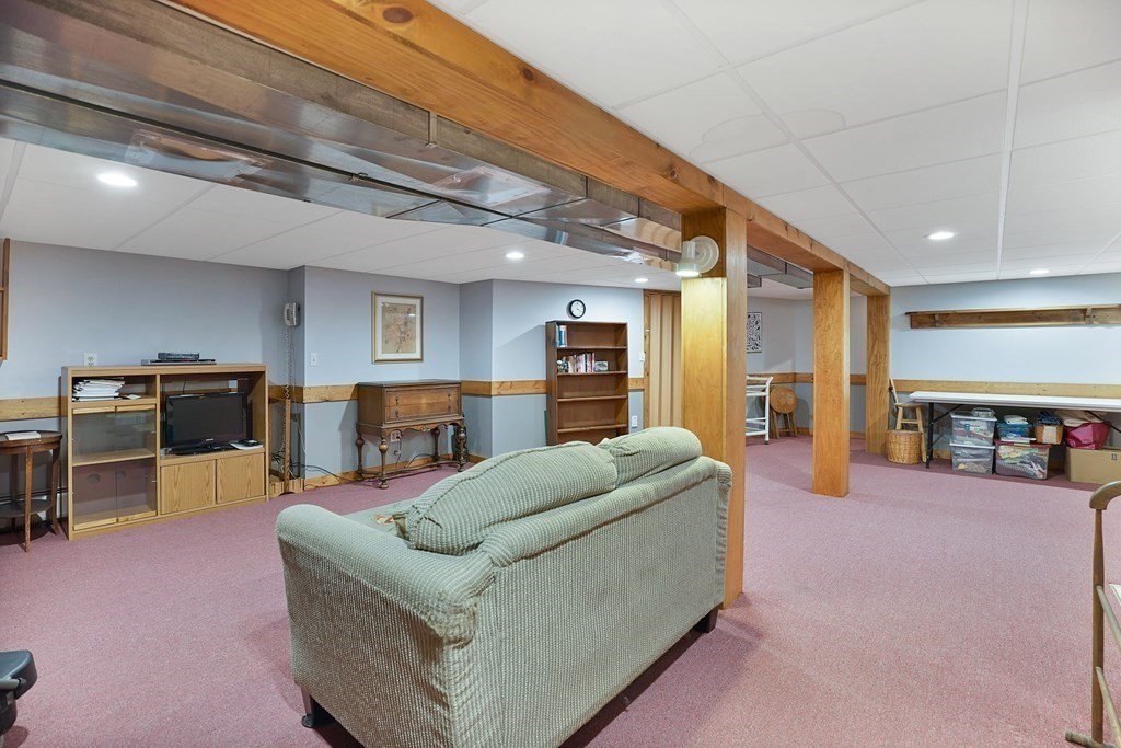 17 Pequot Road Southampton, MA 01073 - Photo 33 of 41 a living room with furniture and a flat screen tv