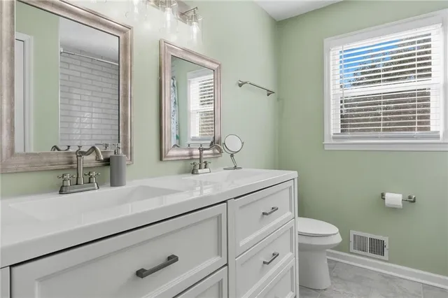 a bathroom with a bathtub and shower