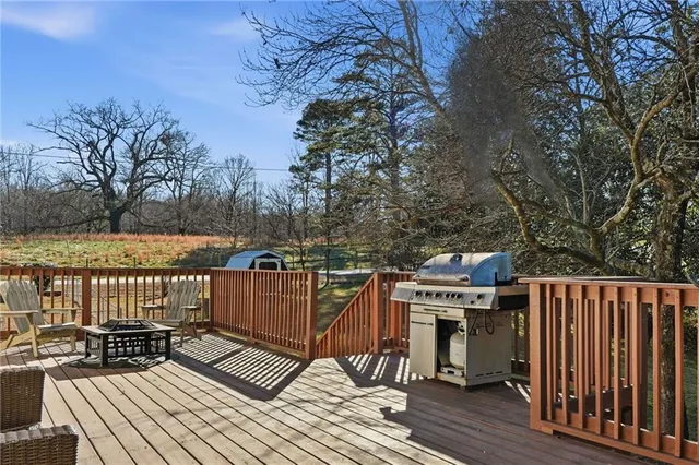 a balcony with wooden floor and fence