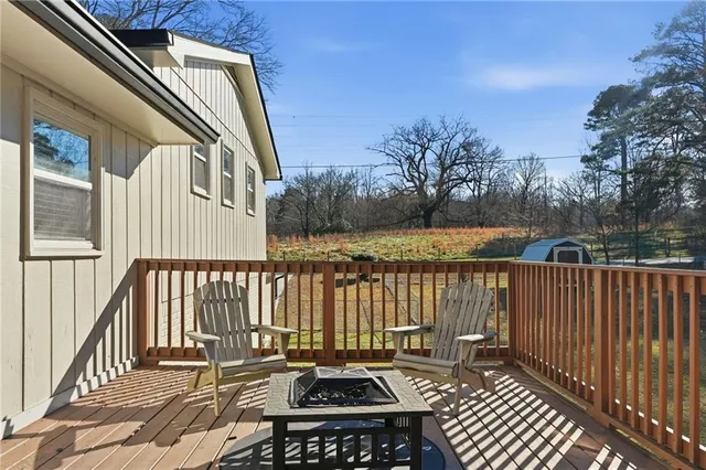 a balcony with wooden floor and fence