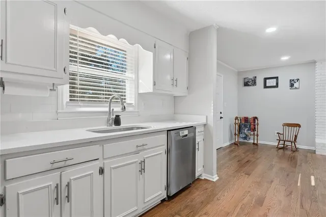 a kitchen with cabinets and appliances
