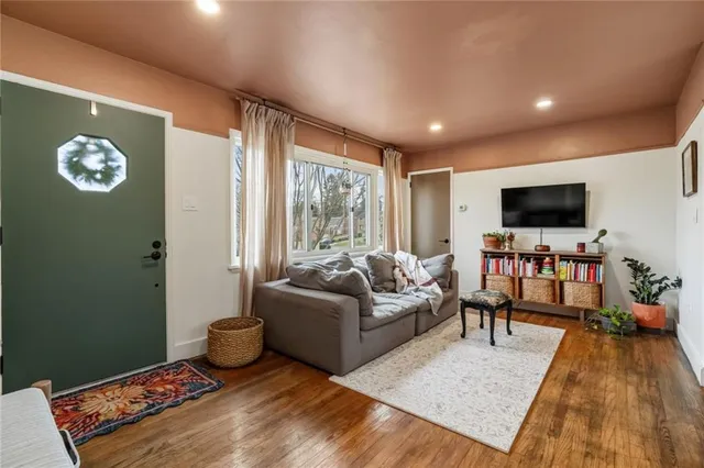a living room with furniture and a flat screen tv